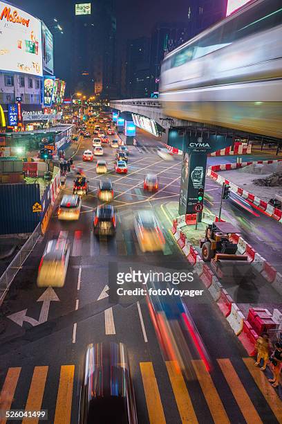 city rush hour traffic futuristic neon night kuala lumpur malaysia - bukit bintang stock pictures, royalty-free photos & images