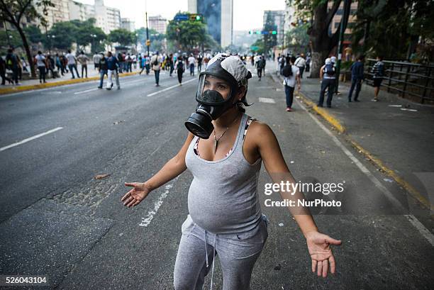 Demonstrators participate in a protest against the government of Venezuelan President Nicolas Maduro in Caracas, Venezuela.The Venezuelan government...