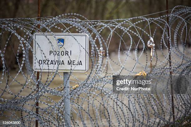 Quot;Caution, national borders&quot; sign on the newly built border fence built by the Slovenian government to separate Slovenia from Croatia. The...