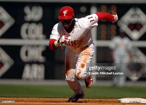 Jimmy Rollins of the Philadelphia Phillies runs towards third base in the game against the Washington Nationals at Citizens Bank Park on April 4,...