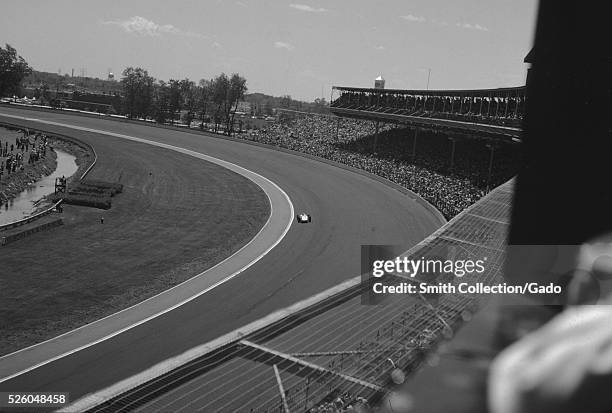 Unidentified race car driver during a qualifying lap for the Indianapolis 500 race at Indianapolis Motor Speedway, Indianapolis, Indiana, 1963. .