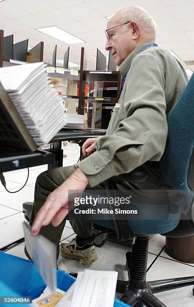 James McCullough sorts tax returns at the Cincinnati Internal Revenue Service Center April 8, 2005 in Covington, Kentucky. The tax filing deadline is...