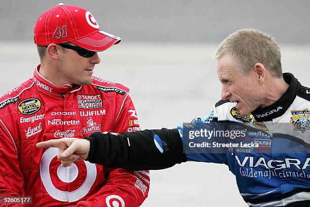 Casey Mears, driver of the Ganassi Racing Target Dodge Charger, talks with Mark Martin, driver of the Viagra Ford, during NASCAR NEXTEL Cup Advance...