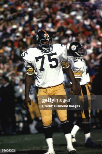 Defensive lineman "Mean" Joe Greene of the Pittsburgh Steelers awaits the next play during a game in the 1975 Season.