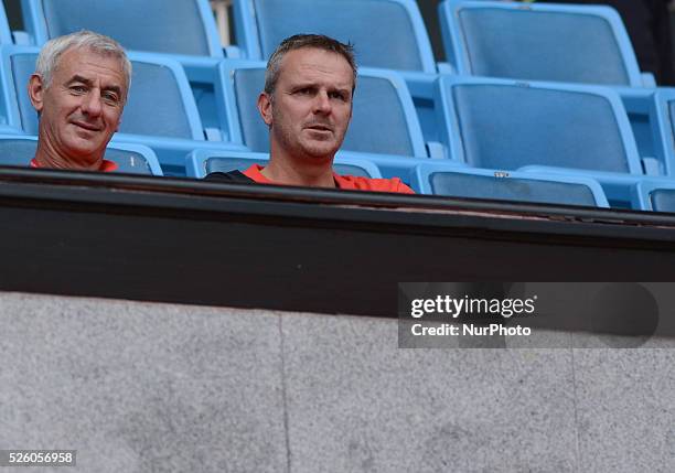 Former Liverpool players Ian Rush and Dietmar Hamann look on as Liverpool players warm up during a training session at Rajamangala stadium in...