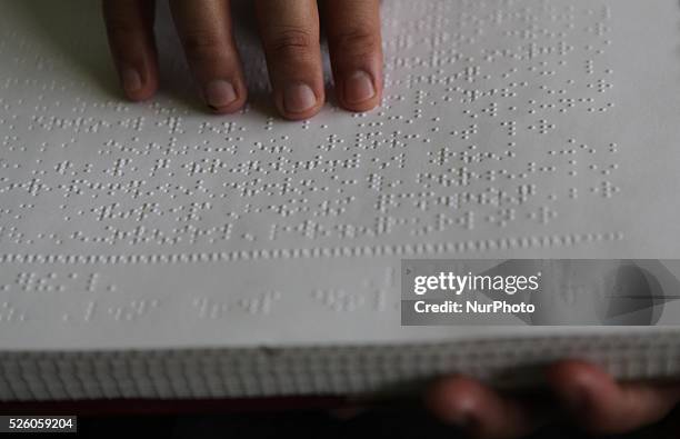 June 24 : Blind men reads a Braille Quran at Raudlatul Makfufin Foundation in Tangerang, outskrit of Jakarta, Indonesia, on June 24, 2015. Braille...