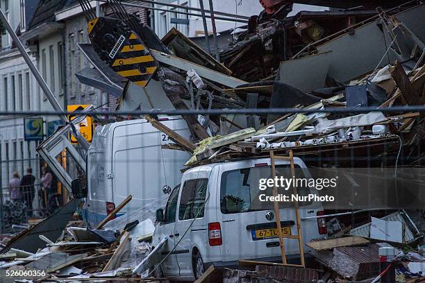 Aug. 6, 2015 - Two large cranes carrying a part of a bridge weighing 190 tons slid of a pontoon and crashed into several houses along the canal. The...