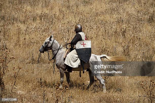 An Israeli man riding a horse and wearing a knight costume takes part in the reenactment of the Hattin Battle in Horns of Hattin, North of Israel on...