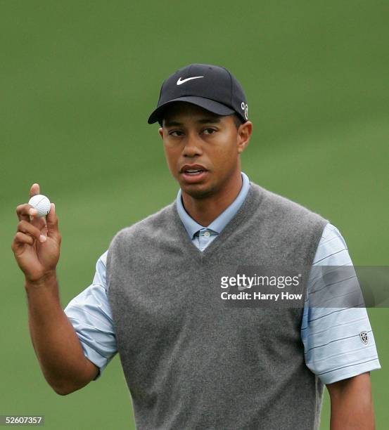 Tiger Woods waves to the gallery on the second green during the second round The Masters at the Augusta National Golf Club on April 9, 2005 in...