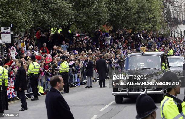 United Kingdom: A Rolls Royce car carrying Britain's Prince Charles and Camilla Parker Bowles drives up Windsor High Street to The Guildhall 09 April...