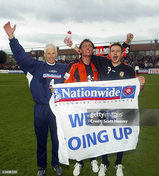 Barnet manager Paul Fairclough with Captain Ian Hendon and match winner Giuliano Grazioli celebrate winning the Nationwide Conference and promotion...