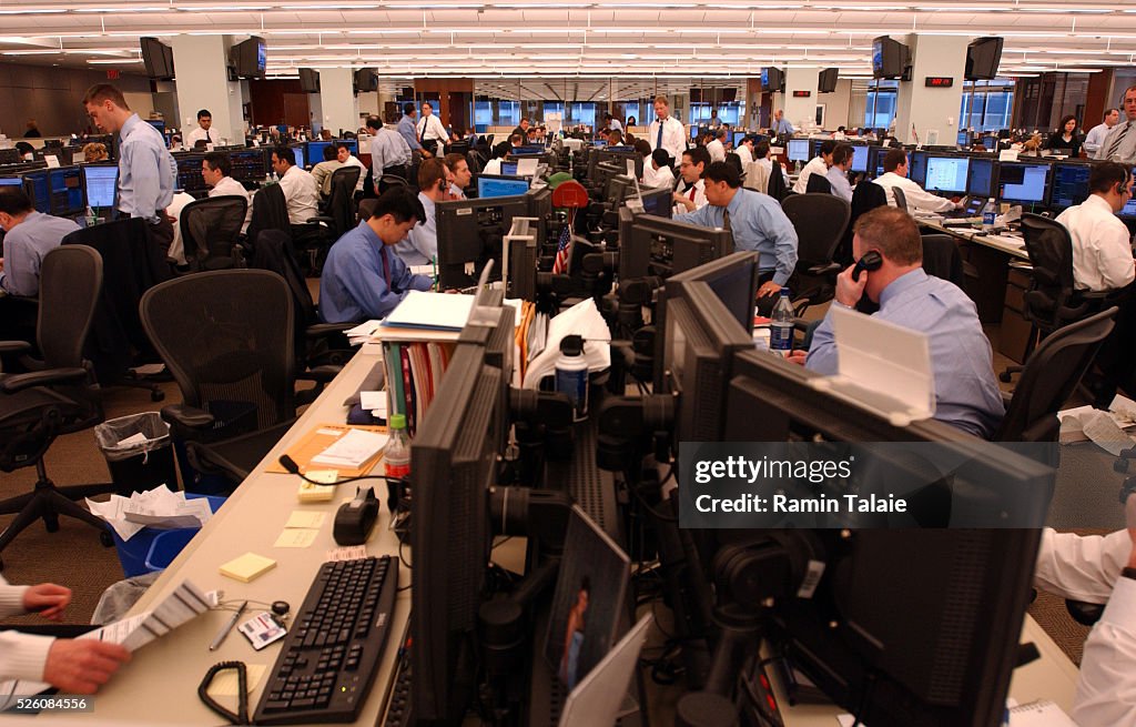 Analysts and traders on the trading floor of Bear Stearns, monitor