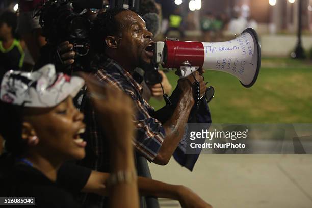 Protesters in front of the Ferguson Police Headquarters ahead of the 1-year-anniversary of the death of Michael Brown on August 7, 2015 in Ferguson,...