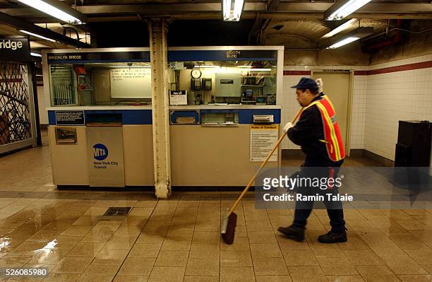 Station worker continues to clean at the City Hall stop in New York City, as the the midnight deadline passes for an MTA strike on Thursday, December...