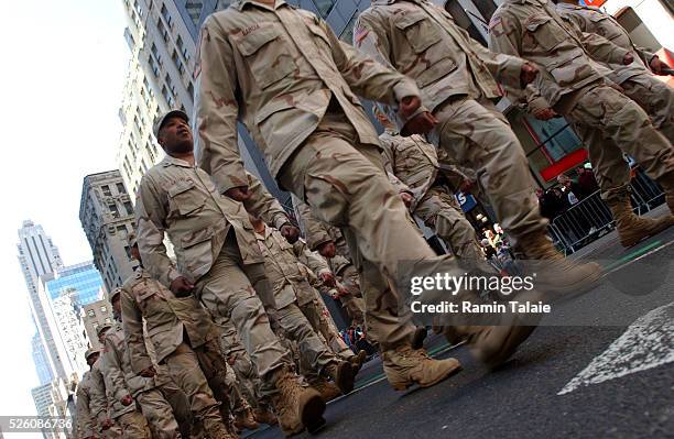 Members of the Fighting 69th Infantry Division of the New York National Guard, which lost 19 soldiers in Iraq, march up on Fifth Avenue leading the...