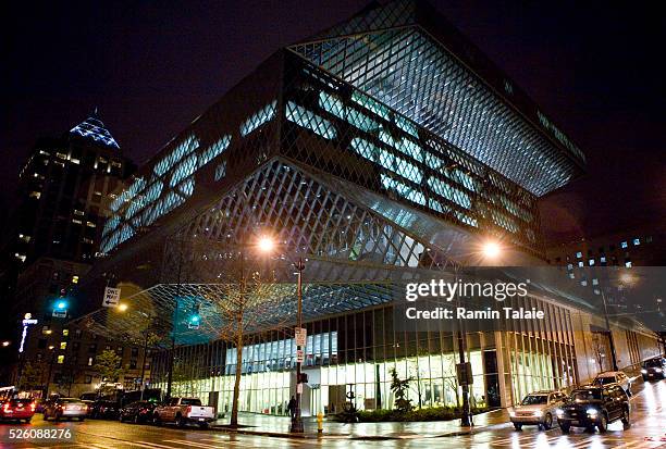 The streets and cars outside Seattle Public central branch at night, designed by Dutch architect Rem Koolhaas of OMA . Opened in 2004, Seattle Public...