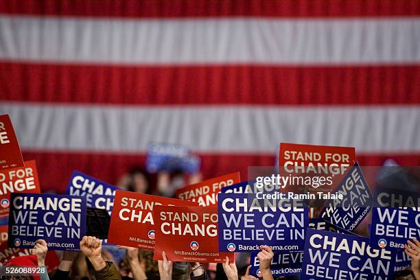 Supporters of Democratic Presidential hopeful Senator Barack Obama hold up signs during a rally at the Nashua South High School after Obama conceded...