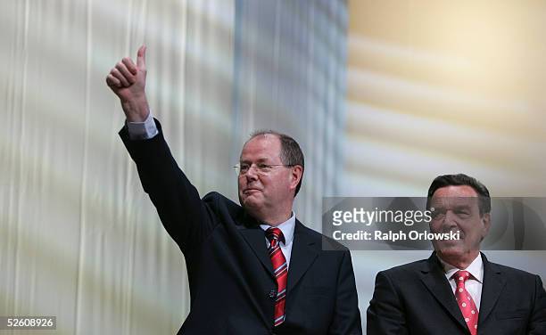 The top candidate for prime minister of Northrhine-Westphalia, Peer Steinbrueck , stands next to German Chancellor Gerhard Schroeder during a SPD...