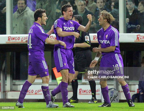 Fiorentina's Giorgio Chiellini celebrates his goal with teammates Enzo Maresca and Marco Donadel during their Italian Championship match against...