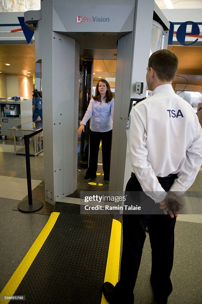 Tsa Security Scanner A Transportation Security Administration officer monitors a passenger ...