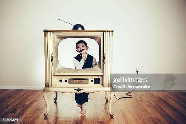 preschool child playing anchorman in old tv - television show bildbanksfoton och bilder