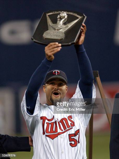 Pitcher Johan Santana of the Minnesota Twins holds his 2004 Cy Young trophy that was presented to him before the start of the Twins' American League...