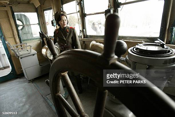 North Korean army guide Kim Mi-Gyong looks around the bridge on the USS Pueblo, a 53.8-metre-long ship the North Koreans seized in 1968 after...