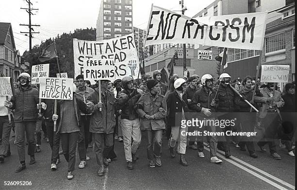 Militant anti war and anti racism demonstratiors march through the streets of Portland. Note that many of the demonstrators are wearing helments,...