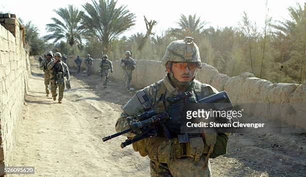 Member of H Company, 4th Brigade, 2nd Infantry leads his fellow soldiers as they enter the town of Arab Jabour in the Diyala district of Iraq. The...