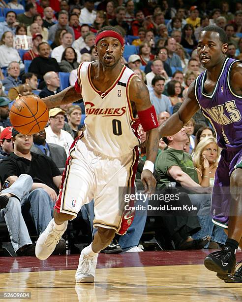 Jeff McInnis of the Cleveland Cavaliers drives against Anthony Goldwire of the Milwaukee Bucks at Gund Arena on April 9, 2005 in Cleveland, Ohio. The...
