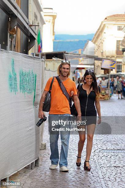 Italian model Claudia Romani and her boyfriend Kevin Gleizes walks in the street of L'Aquila, on August 25, 2013. Claudia Romani was born in L'Aquila...
