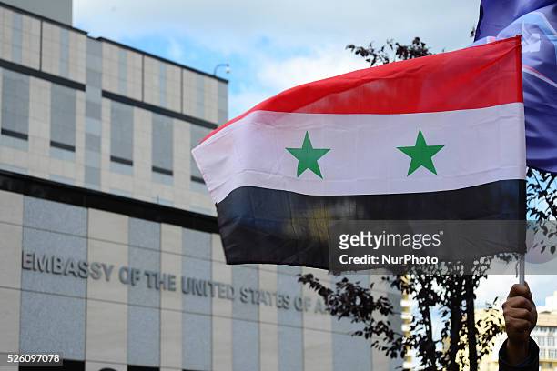 Syrian diaspora of Ukraine and activists from different political parties and NGOs of Ukraine protest in front of the US Embassy in Ukraine during...