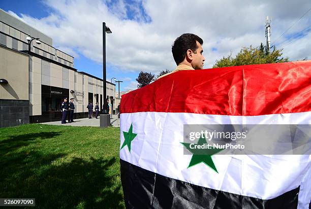 Syrian diaspora of Ukraine and activists from different political parties and NGOs of Ukraine protest in front of the US Embassy in Ukraine during...