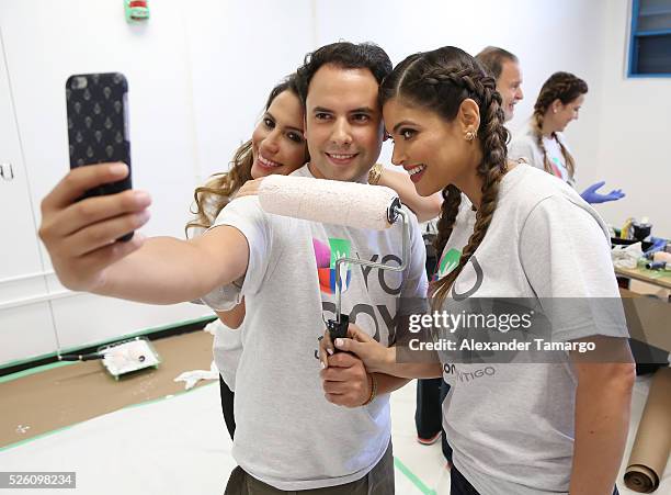 Lindsay Casinelli, Alejandro Berry and Chiquinquira Delgado are seen during Univision's Media Centers/Week of Service at Ruben Dario Middle School on...