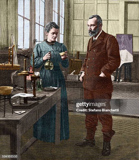 Marie Curie and Pierre Curie shown in their laboratory on rue Lhomond in Paris.