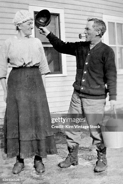 Pa comes in after milking the cows, ca. 1910