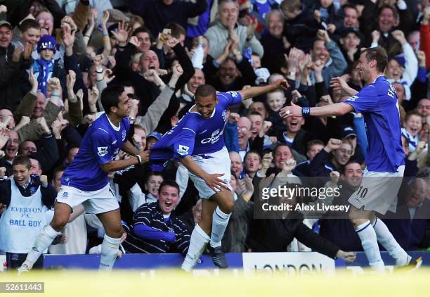 James Vaughan of Everton, who made his debut as the youngest player in the history of the club, celebrates his goal with Tim Cahill and Duncan...