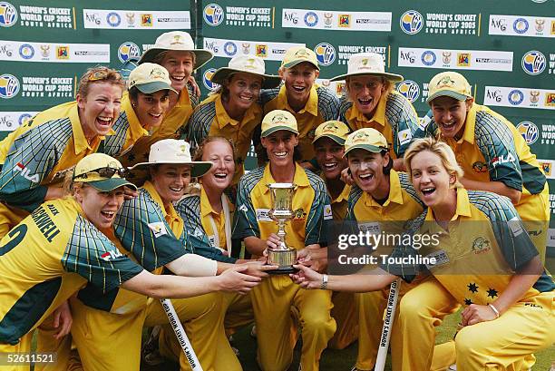 The Australia team pose with the trophy after winning the IWCC Women's World Cup Final between India and Australia at Supersport Park Stadium on...
