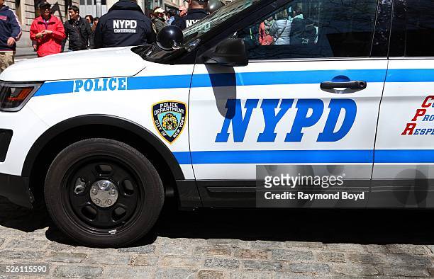 New York City police SUV with two NYPD counter terrorism officers sits on Broadway in New York, New York on April 15, 2016.