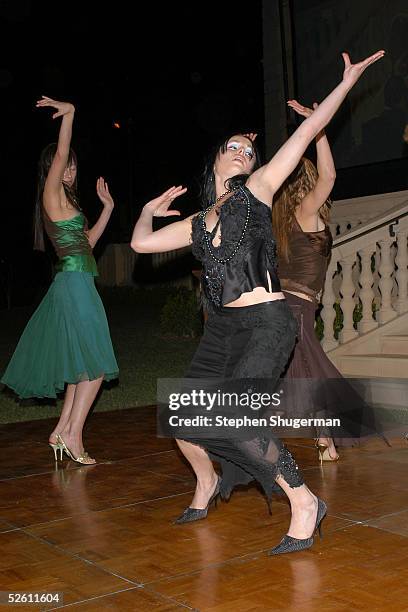 Models pose during the fashion show at Chrysalis' Fourth Annual Butterfly Ball at a private residence on April 9, 2005 in Bel Air, California.