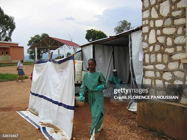 Health worker leaves an isolated area 10 April 2005 in Uige, about 300km north of the capital, Luanda, in a makeshit tent where Marburg-virus...