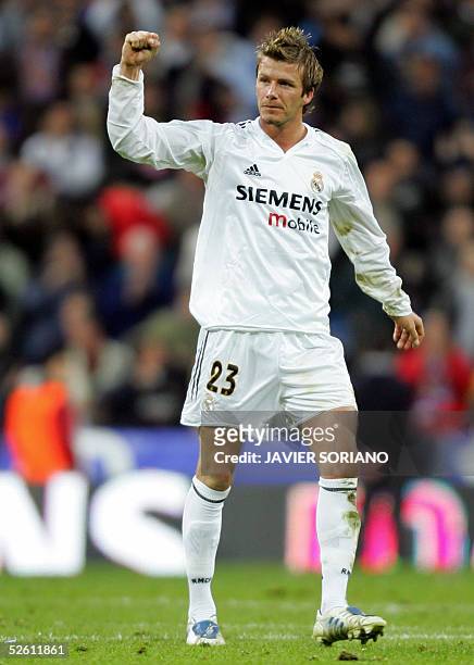 Real Madrid's Briton David Beckham gestures after his team won against Barcelona during their Spanish Premier League football match at Santiago...