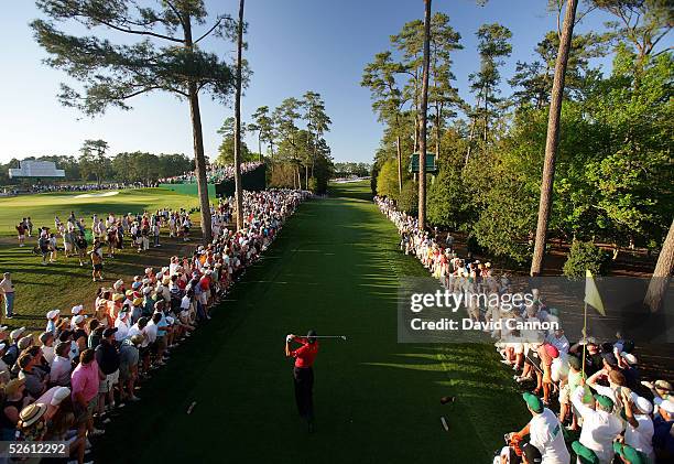 Tiger Woods hits his tee shot on the 18th tee during the final round of The Masters at the Augusta National Golf Club on April 10, 2005 in Augusta,...