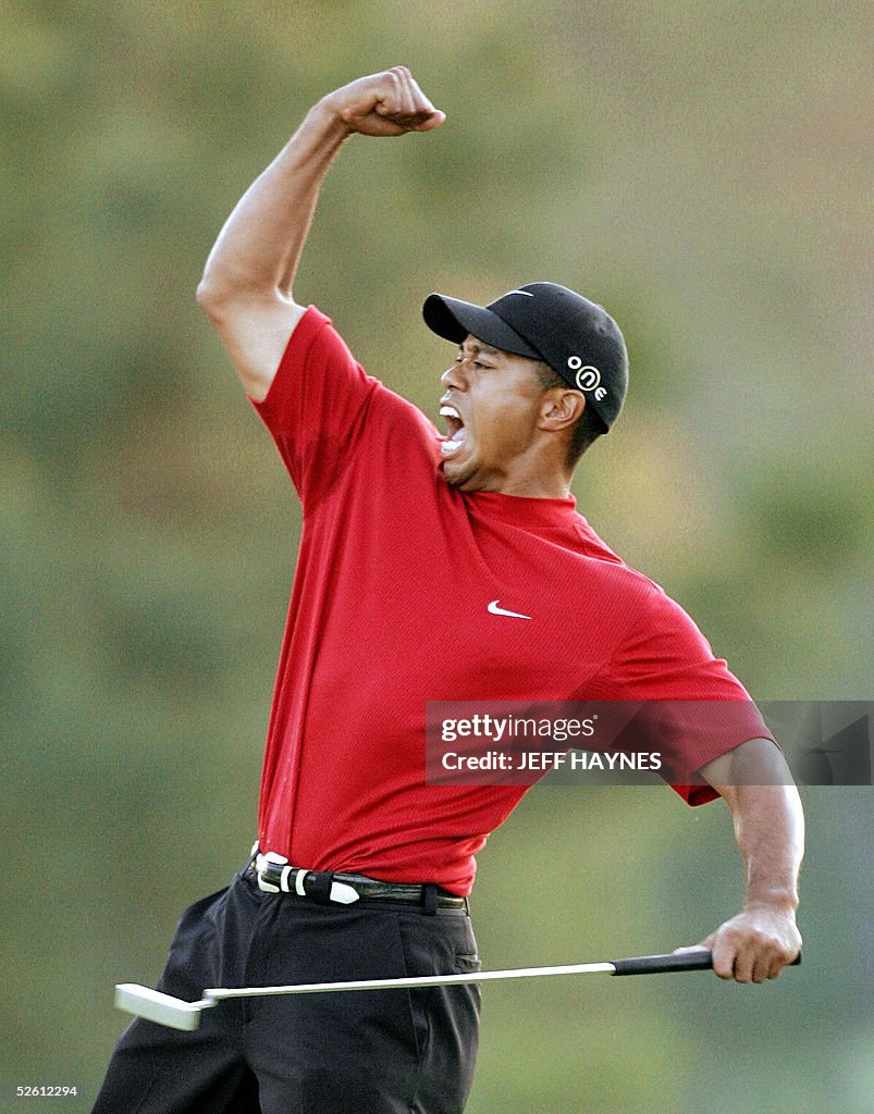Tiger Woods of the US celebrates winning