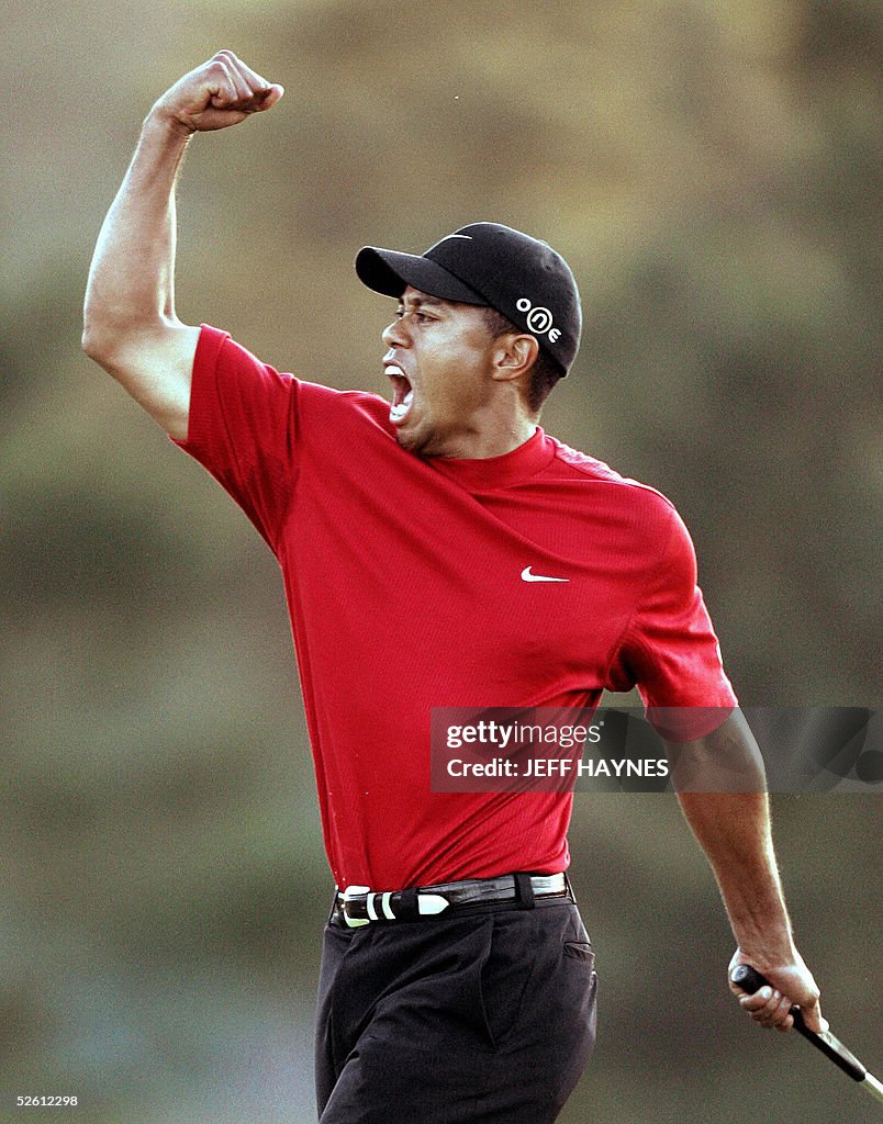 Tiger Woods of the US celebrates winning