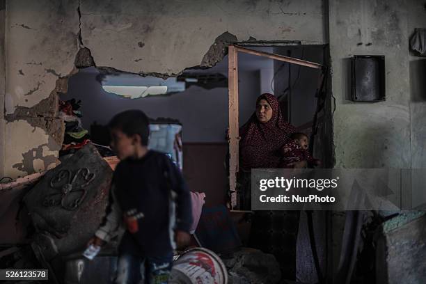 Palestinian woman stands in his home destroyed during the 50-day conflict between Hamas militants and Israel, in Shejaiya neighbourhood in the east...