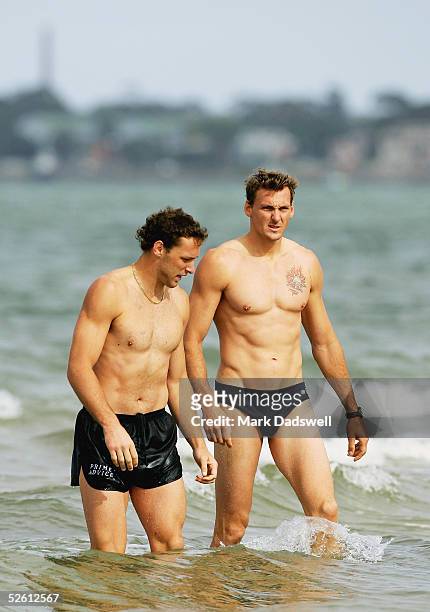 Mitch Hahn and Daniel Bandy leave the water during the Western Bulldogs AFL recovery session at the Port Melbourne Life Saving Club April 11, 2005 in...
