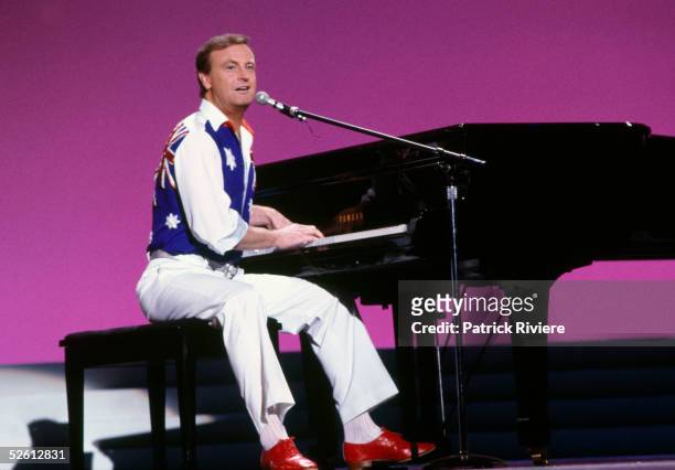 Australian singer Peter Allen sings at the State Sport Centre in Homebush March 12, 1985 in Sydney, Australia. The pageant was telecast was live and...