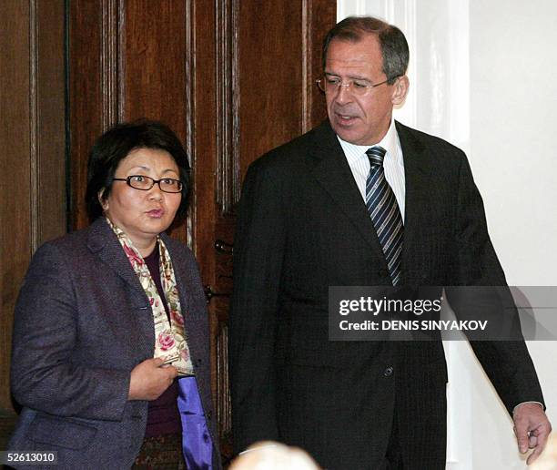 Russian Foreign Minister Sergey Lavrov and Kyrgyz acting Foreign Minister Roza Otunbayeva arrive for talks in Moscow, 11 April 2005. The Kyrgyz...