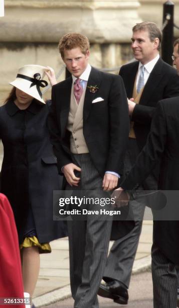 Princess Eugenie , Prince Andrew and Prince Harry , checking his trouser fly, are seen following the Service of Prayer and Dedication after the...